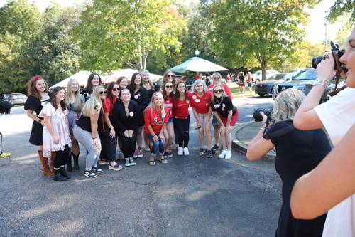 Sorority sisters pose for a group photo at Homecoming