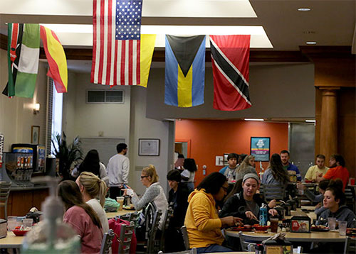 Pitts Dining Hall adorned with flags from around the world