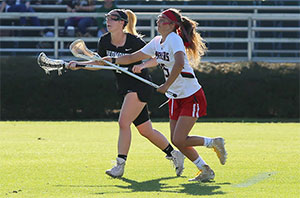 Lacrosse players struggle for control on the field