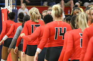 Volleyball players congratulate the other team following a match