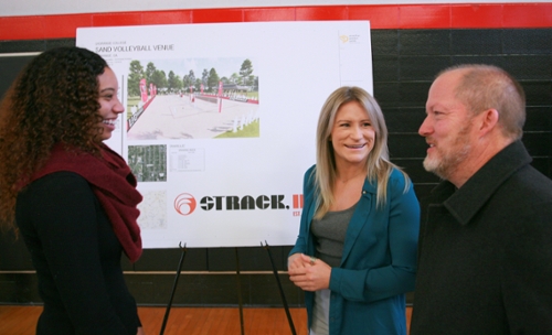 Scott Malone talks with beach volleyball coaches