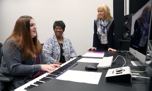 Babbie Mason, center, listens to student Simmerly Hardage's song as Dr. Toni Anderson, Coordinator of the Music Program, listens.