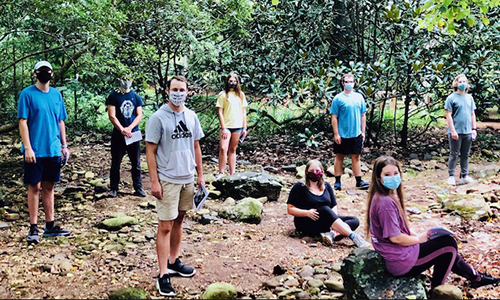Students stand socially distanced while practicing for the fall Theatre performance