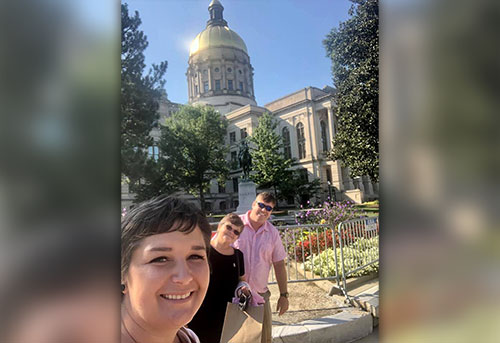 Lacee Landrum and her family pause outside the state capitol on the day 'her' bill was signed into law.