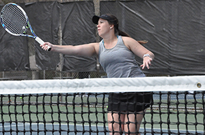 Morgan McDonald returning a volley on the tennis court