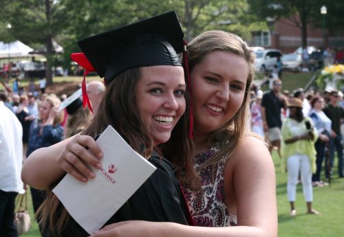 Friends celebrate at a past commencement