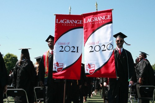 Students carrying class banners for 2020 and 2021 lead the processional
