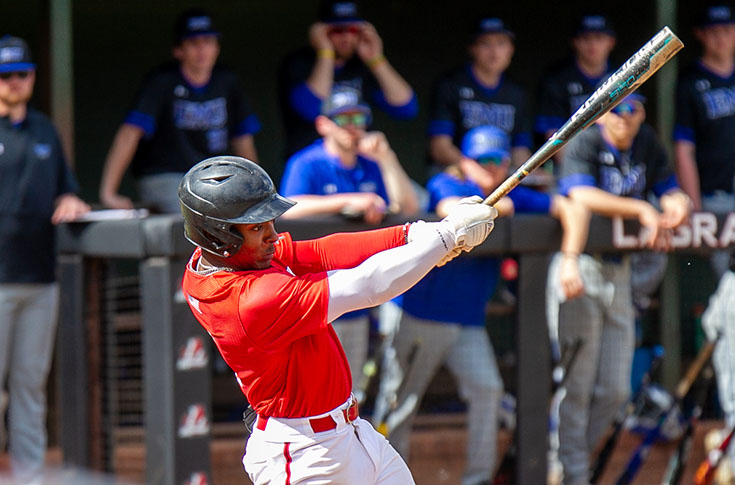 Baseball batter swings away