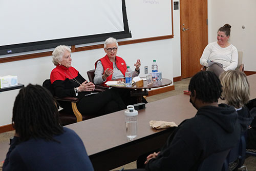 Mavis and Judy speak to a group of students
