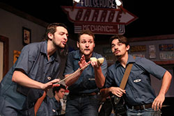 Actors from The Pump Boys and Dinettes perform on stage