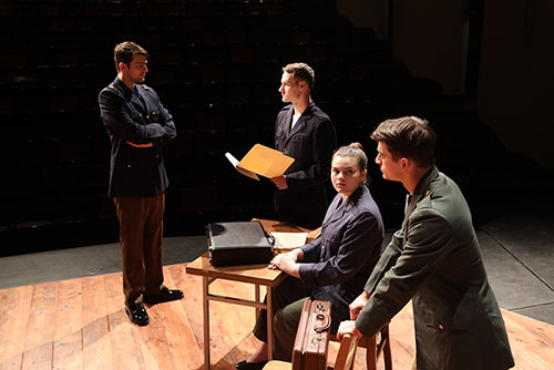 The cast of A Few Good Men rehearse for an upcoming performance
