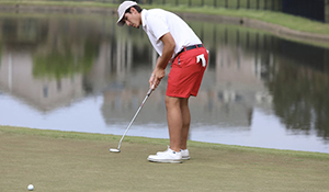 Golfer makes a putt