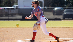 Softball pitcher throws the ball
