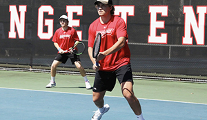 Panther doubles partners prepare for a serve