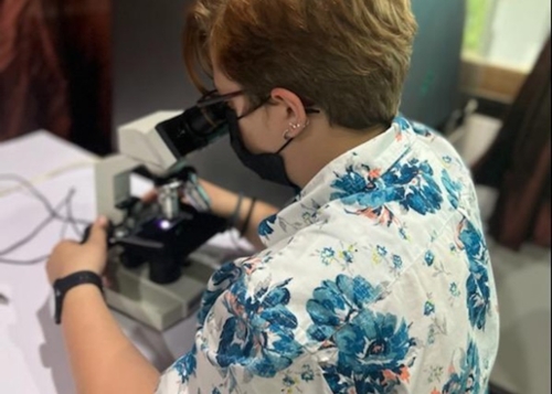 Student at microscope