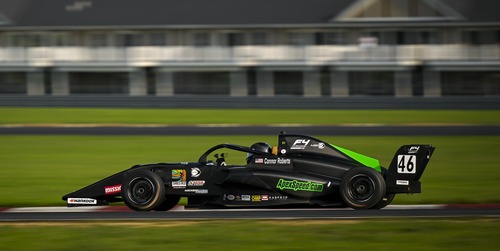 Junior business major drives on course