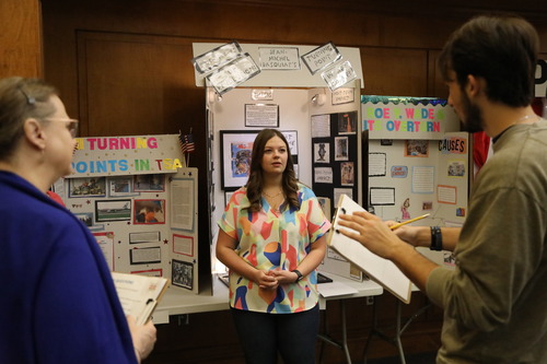 High school student gives presentation at competition