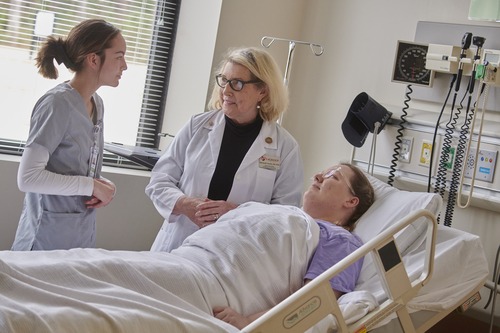 Professor teaches students a workplace scenario