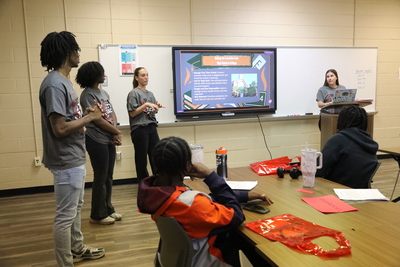 Students giving teaching presentation