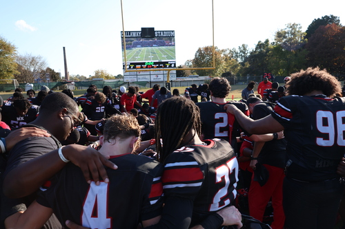 Team gathers for post game huddle