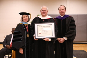 Businessman receives degree