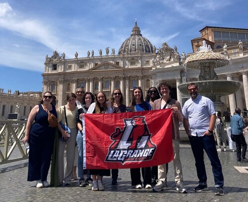 Students pose with school banner in Italy