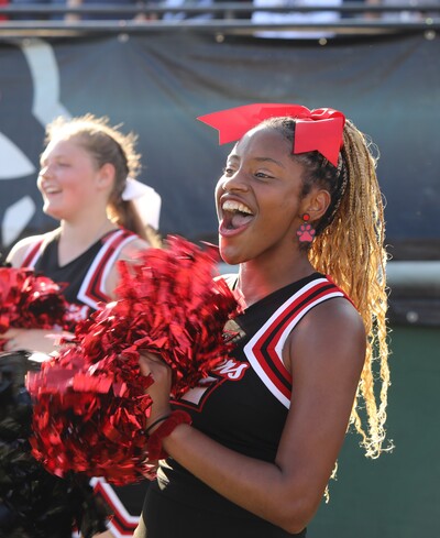 Cheerleader pumping up football team