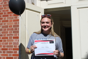 Senior Theatre major rings bell