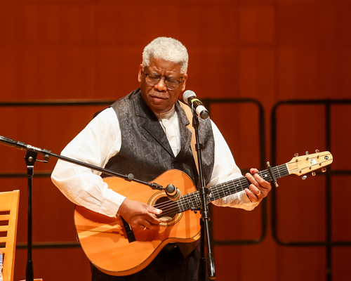 Pastor performs at storytelling event