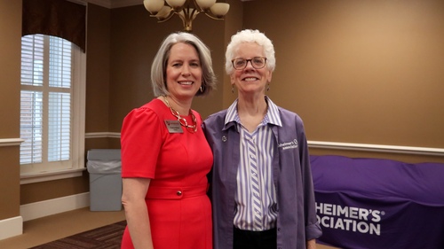 Alumna takes picture with President Susanna L. Baxter