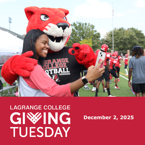 Student posing with Pouncer