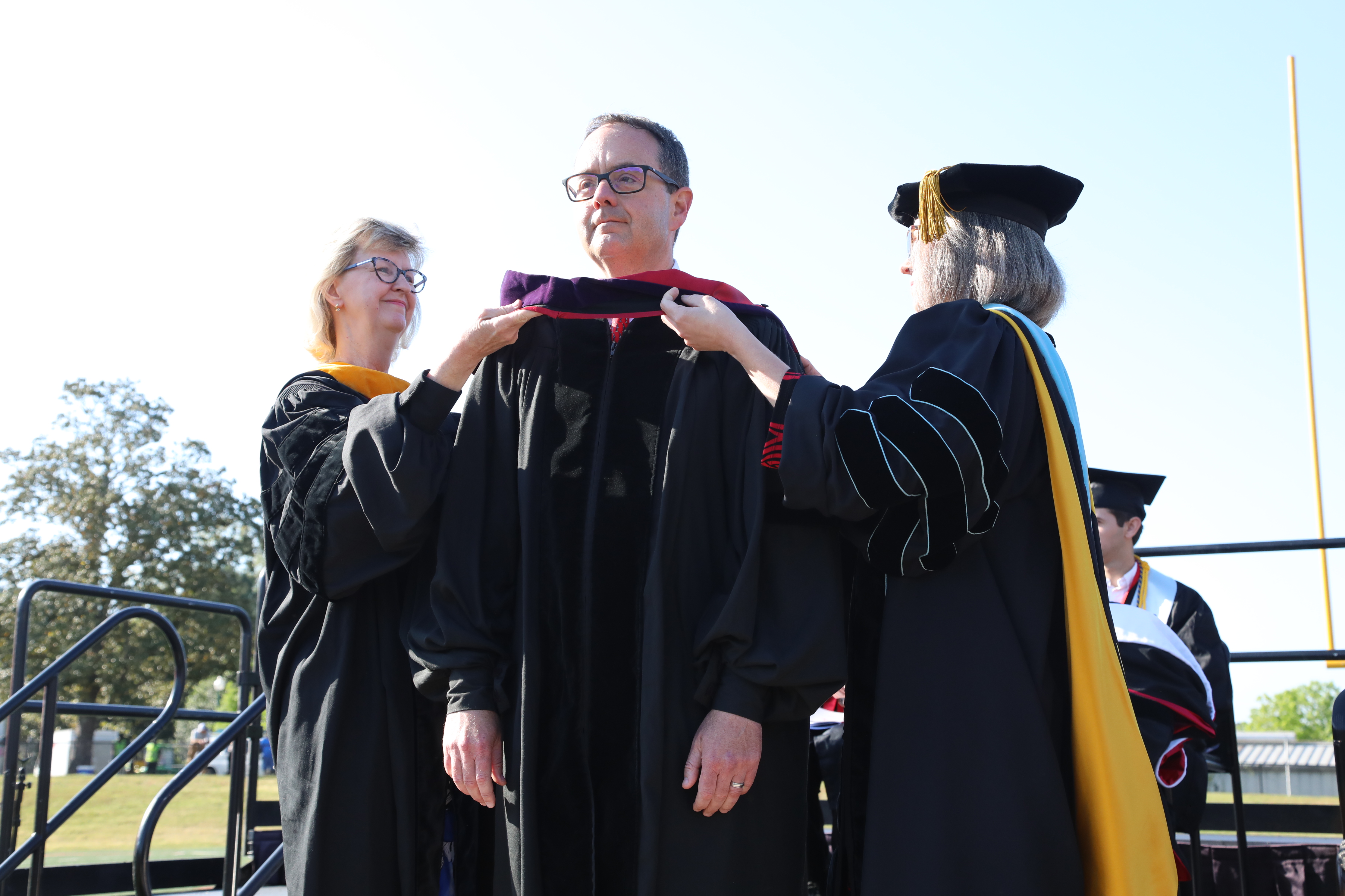 Speaker receives doctoral hood