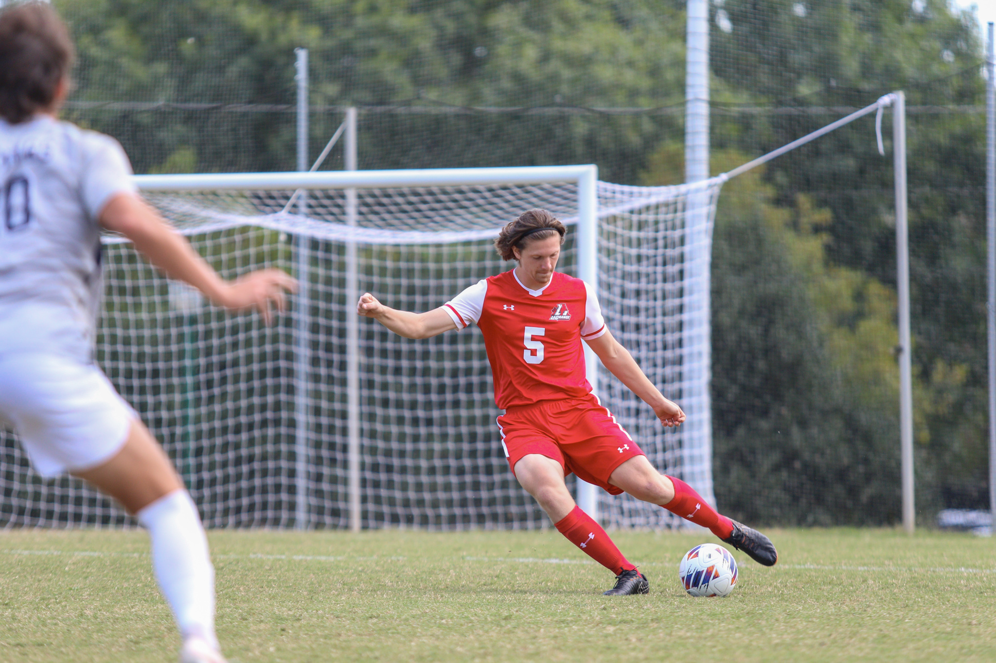 Soccer player runs down field