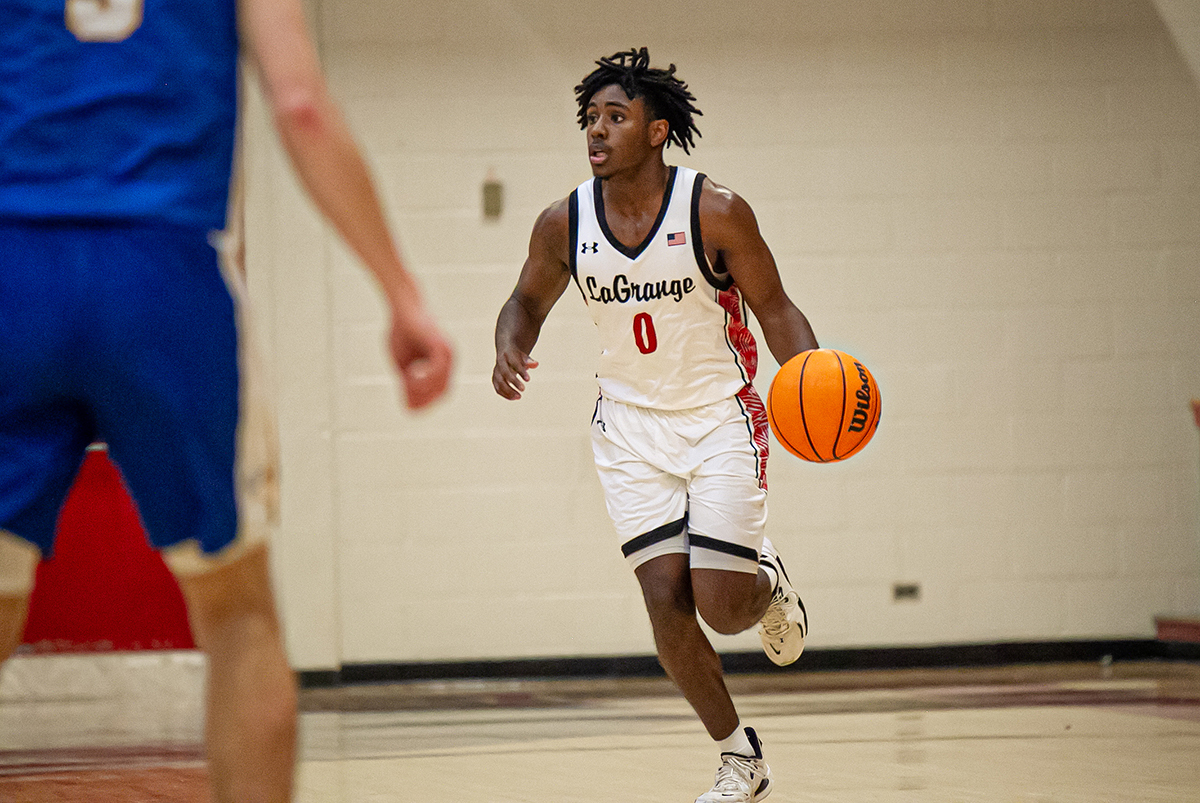 Student running across basketball court
