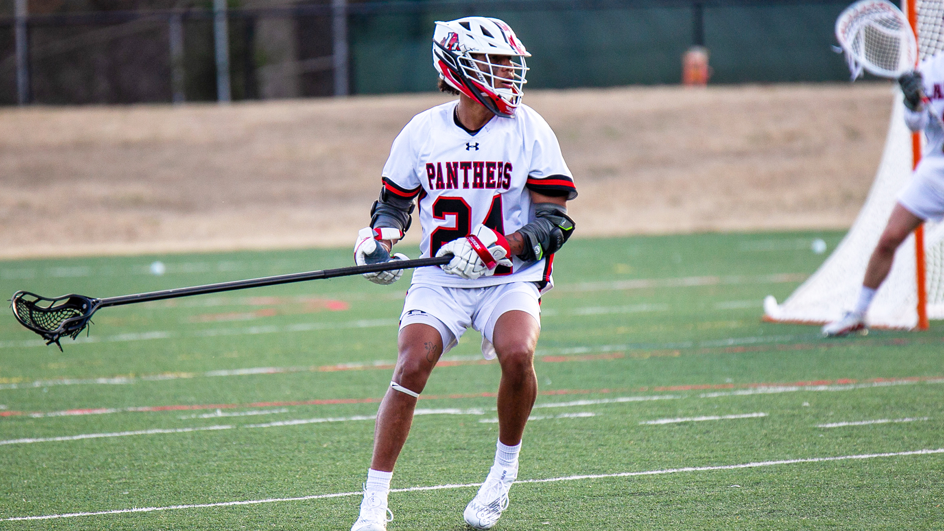 Student playing on field
