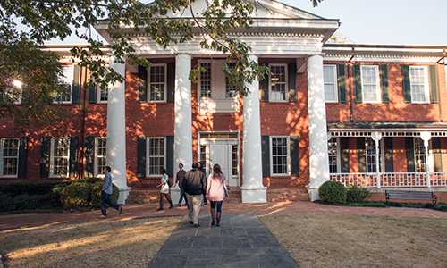 Students approach Smith Hall, which dates to 1850.