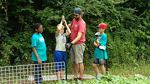 Working as a team at the Learn 2 Serve camp