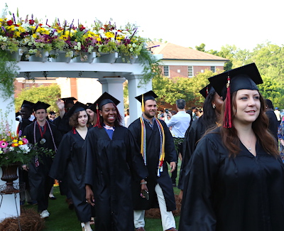 Students march into the graduation ceremony