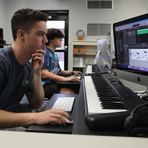 A student works at a computer in the music theory lab
