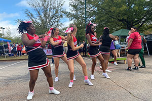 cheerleaders dance at Homecoming tailgate