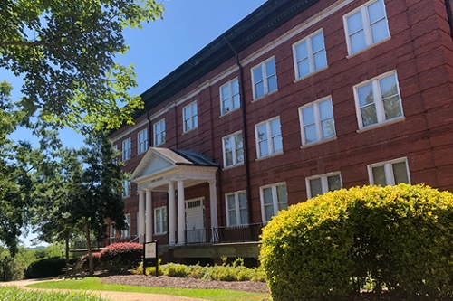 Exterior view of Hawkes Hall in summer