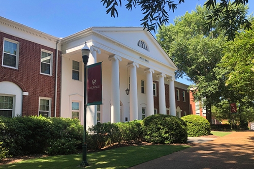 Exterior view of Pitts Residence Hall in summer