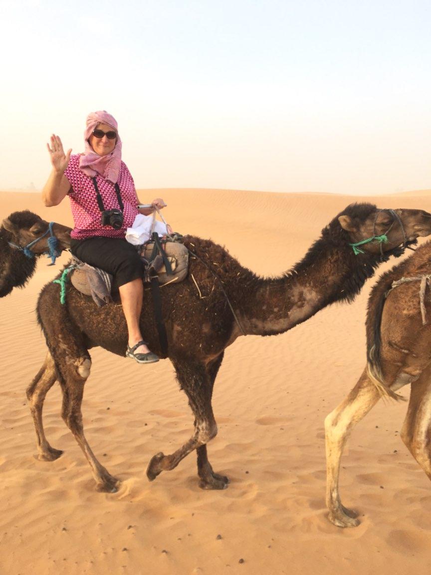 Jane Cooley rides a camel during a 3D Journey's trip to Morocco.