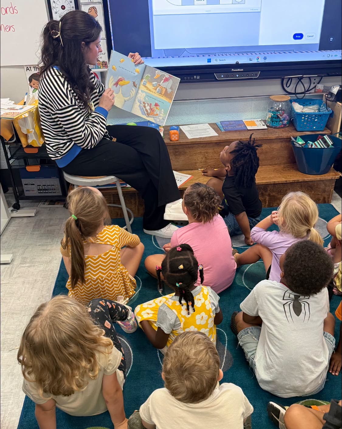 Young teacher working with elementary students