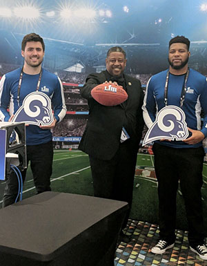 Colton, Preston and Shammar pose with Superbowl memorabilia